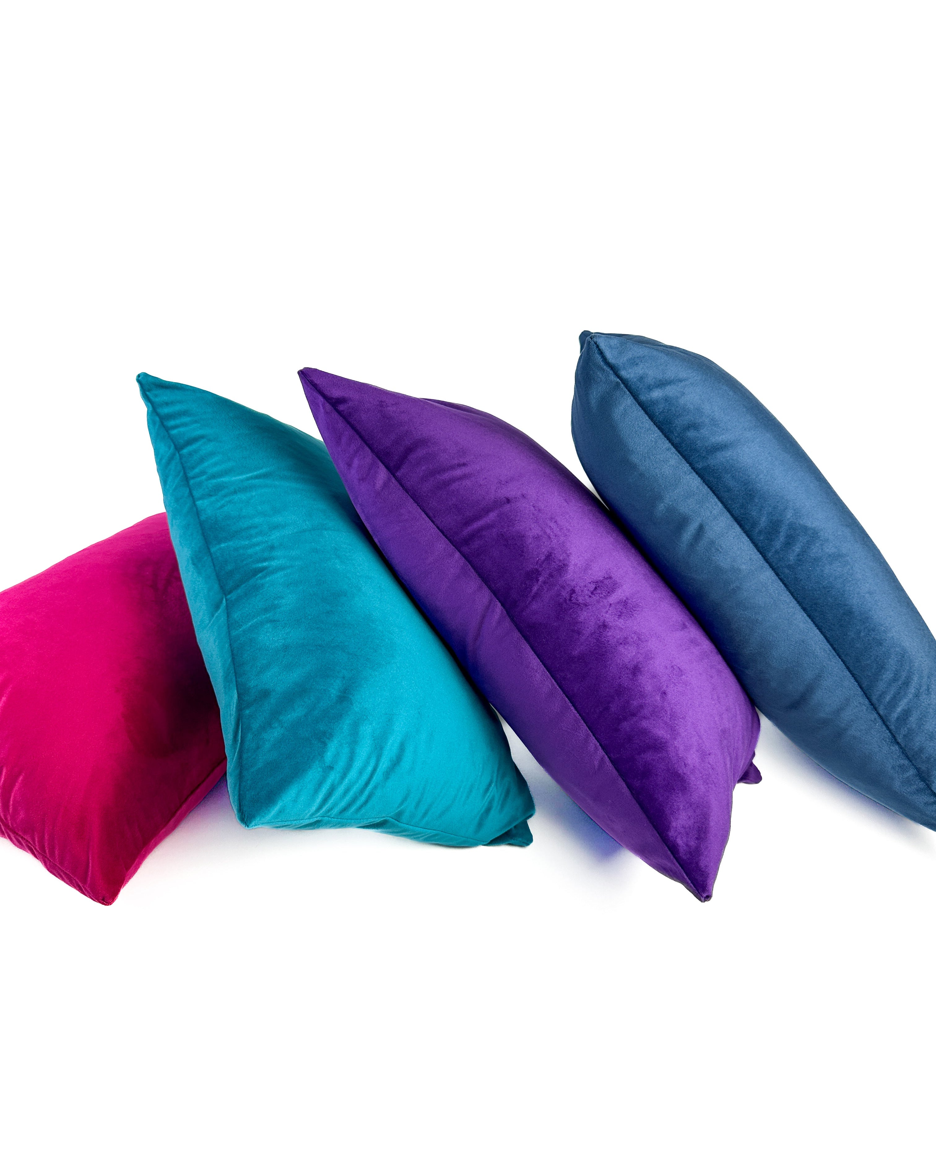 Colorful velvet pillows in shades of blue, pink and purple