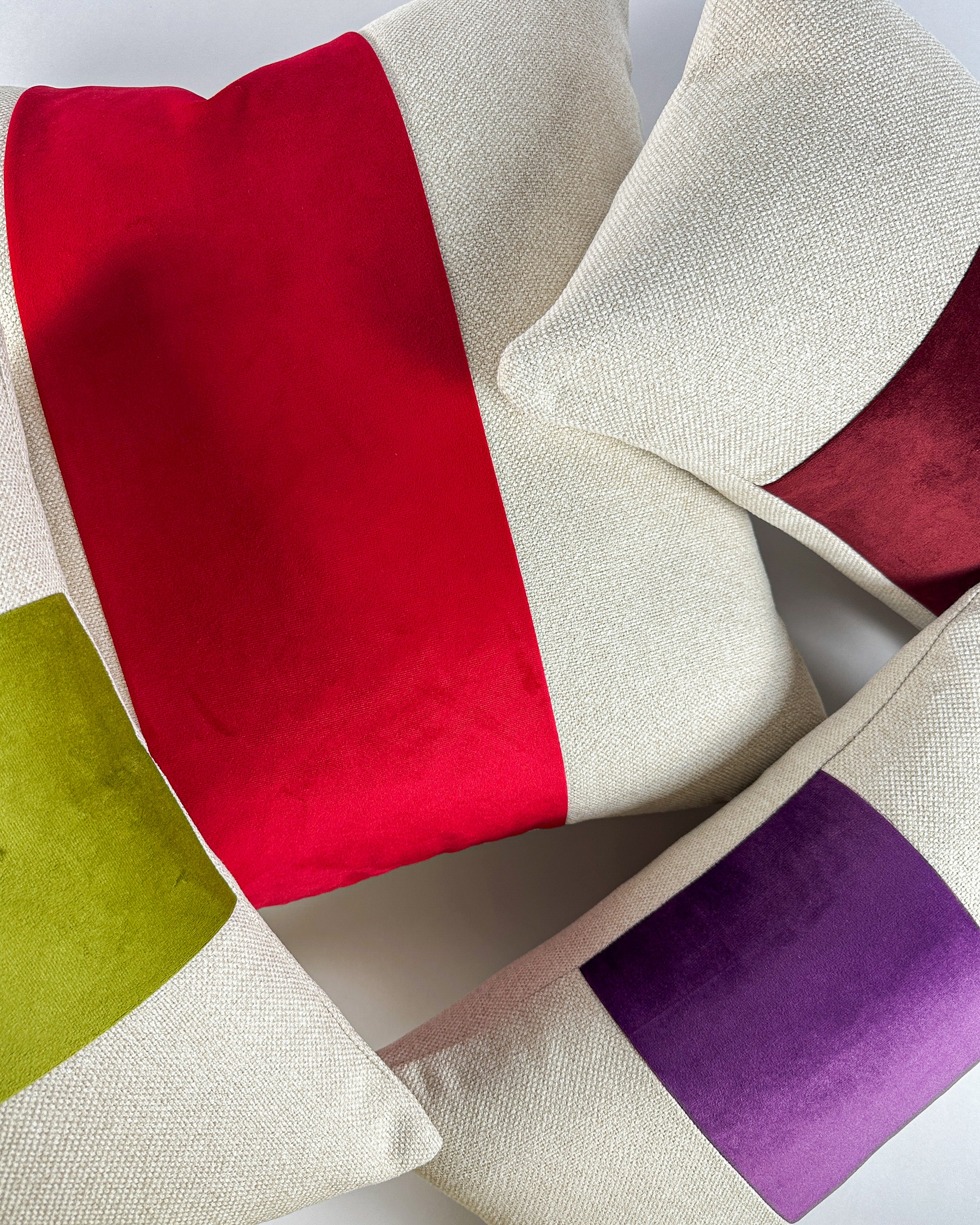 Colorful paneled pillows of various sizes