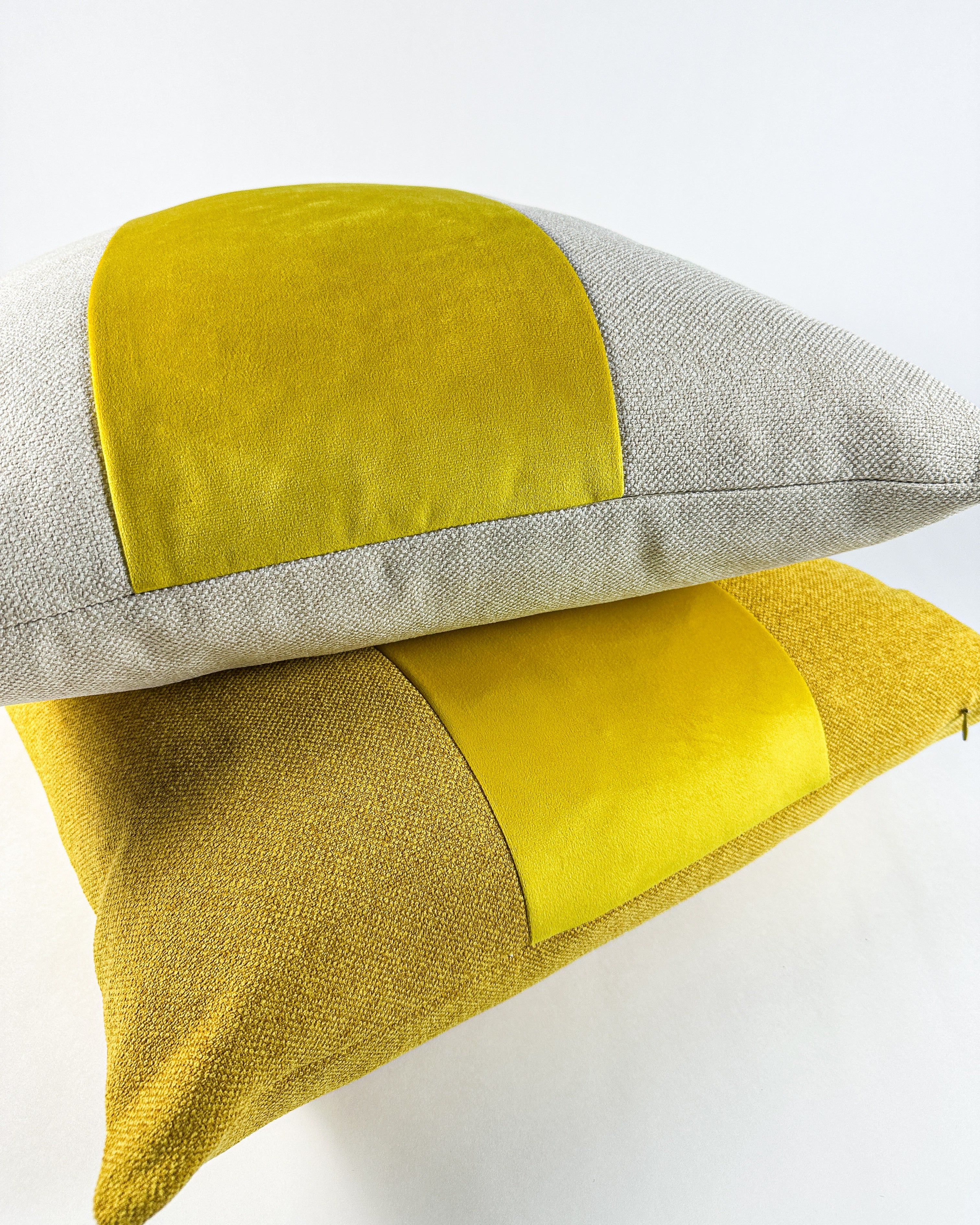 Yellow paneled pillow covers with velvet and woven fabric