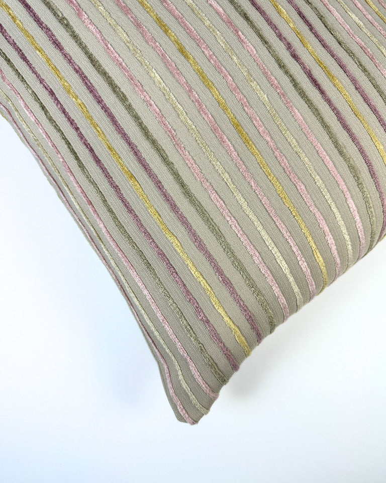 Pastel colored pillow on a white backdrop