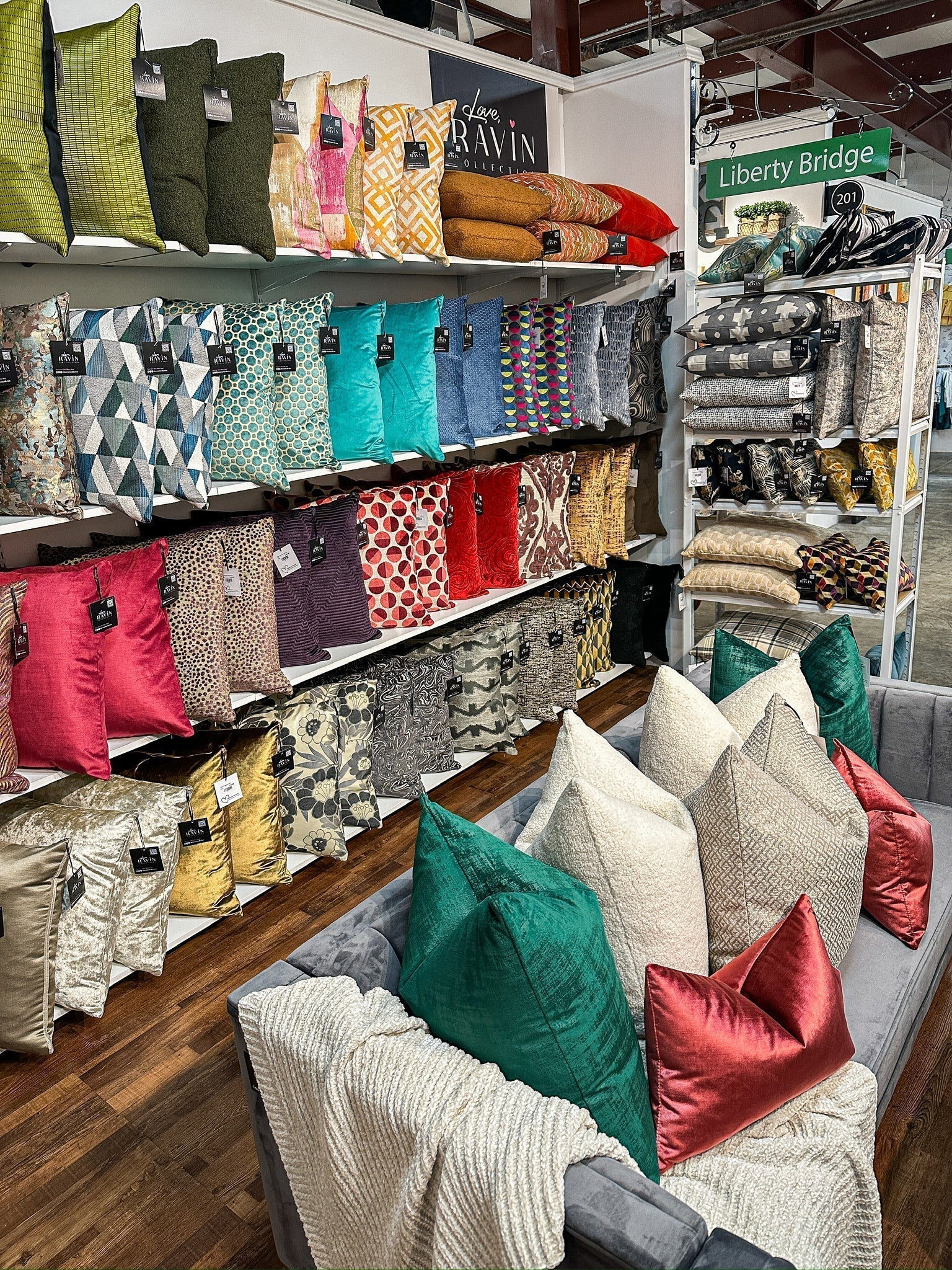 Colorful display of pillows in a storefront setting