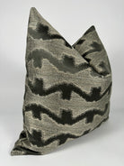 A gray and black patterned pillow cover.