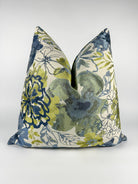 A triangular-shaped pillow cover with a floral pattern in blue and green shades.